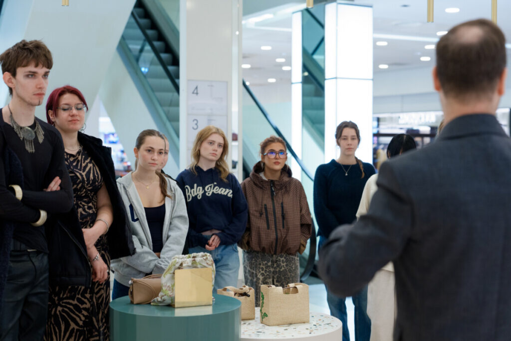 Second Year Fashion Students listening to an in-store talk delivered by Harvey Nichols General Manager Jamie Gardner
